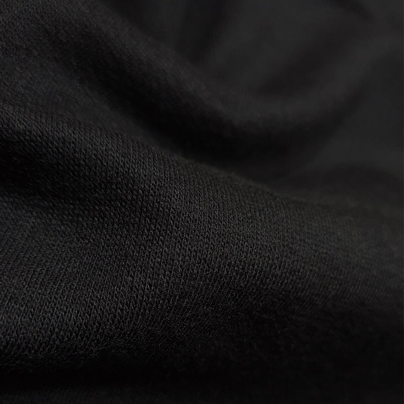 Textura de sueter hecho con algodón orgánico y poliéster de color negro parouzi